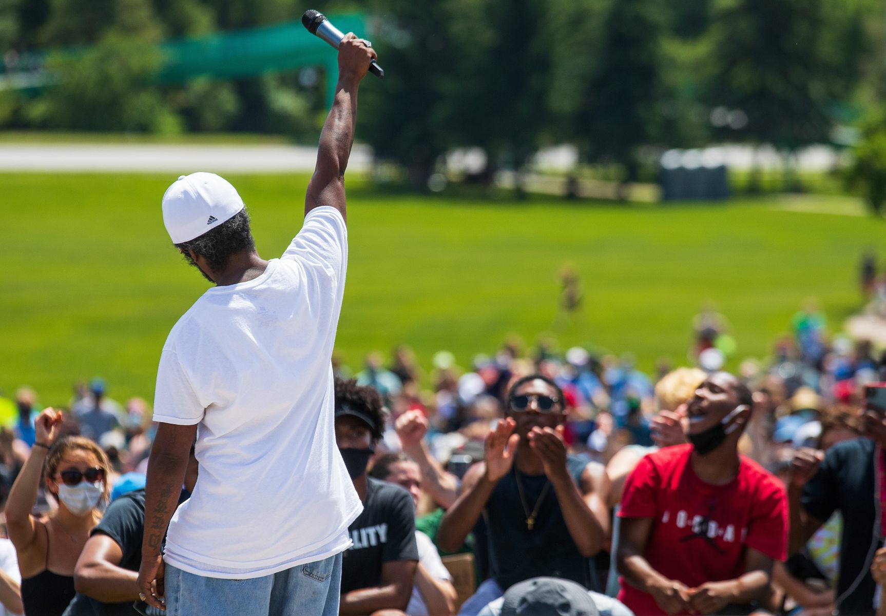 James Scurlock II salutes the crowd